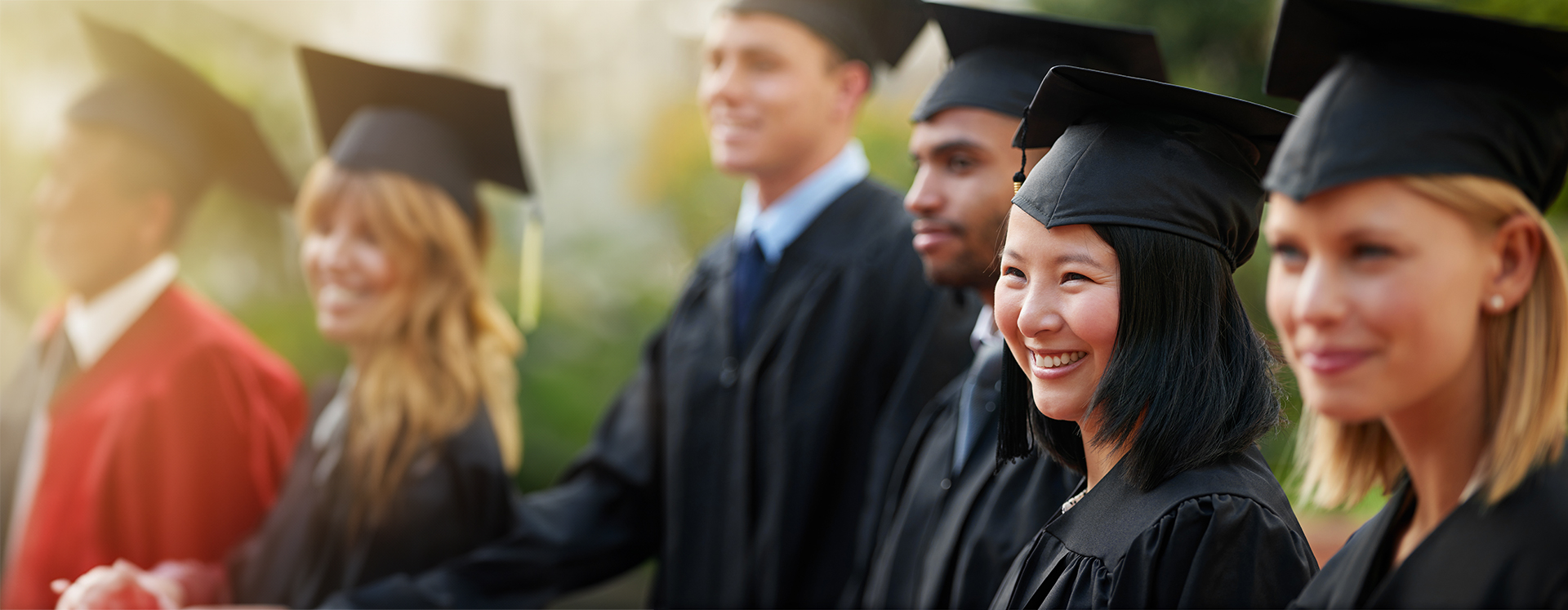 graduates smiling