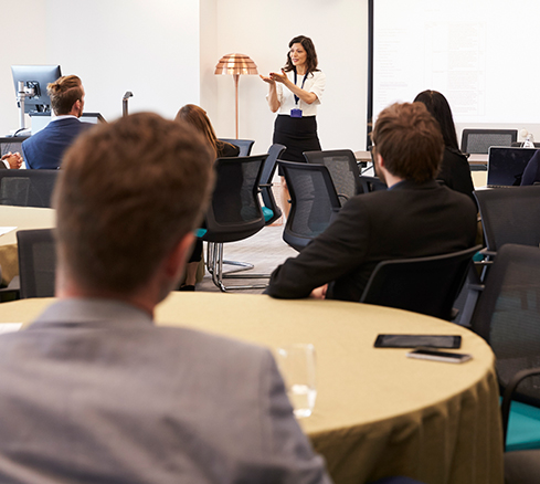 businesswoman making presentation at conference